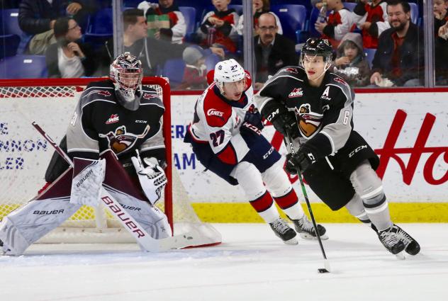 Dylan Plouffe of the Vancouver Giants with the puck against the Lethbridge Hurricanes