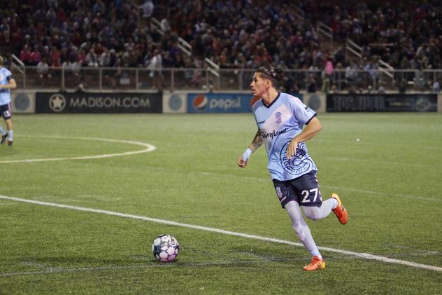 Forward Madison FC defender Christian 