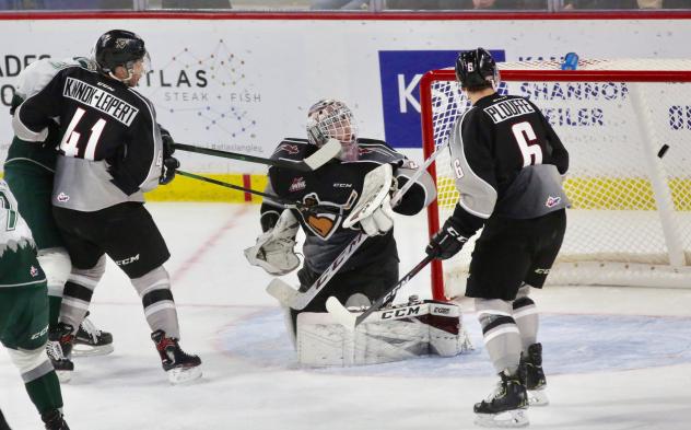 Vancouver Giants goaltender David Tendeck deflects a shot