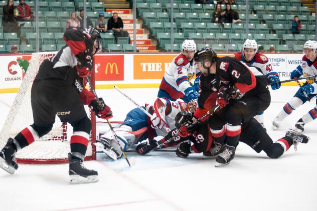 Prince George Cougars defenceman Cole Moberg (2) digs for the puck against the Edmonton Oil Kings
