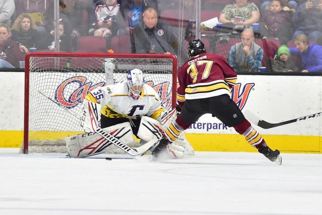 Cleveland Monsters goaltender Veini Vehvilainen stops the Chicago Wolves