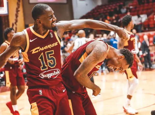 Sir'Dominic Pointer (15) congratulates Sheldon Mac on his game-winning basket for the Canton Charge