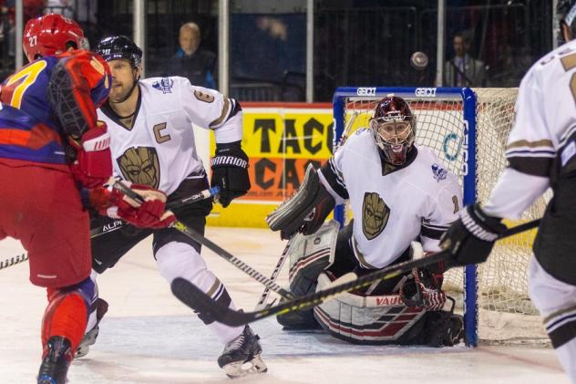 Allen Americans left wing Alex Gutill (far left) eyes the Wichita Thunder goal