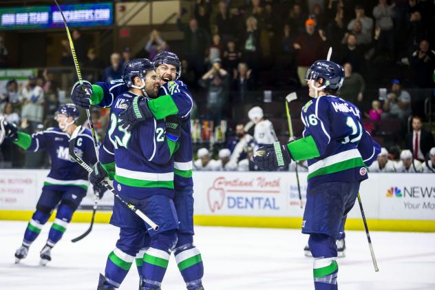 The Maine Mariners celebrate Alex Kile's overtime goal against the Worcester Railers
