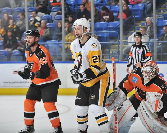 Lehigh Valley Phantoms defenseman T.J. Brennan (left) vs. Jamie Devane of the the Wilkes-Barre/Scranton Penguins