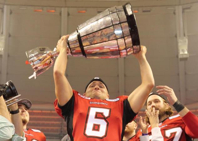 Calgary Stampeders punter Rob Maver lifts the Grey Cup