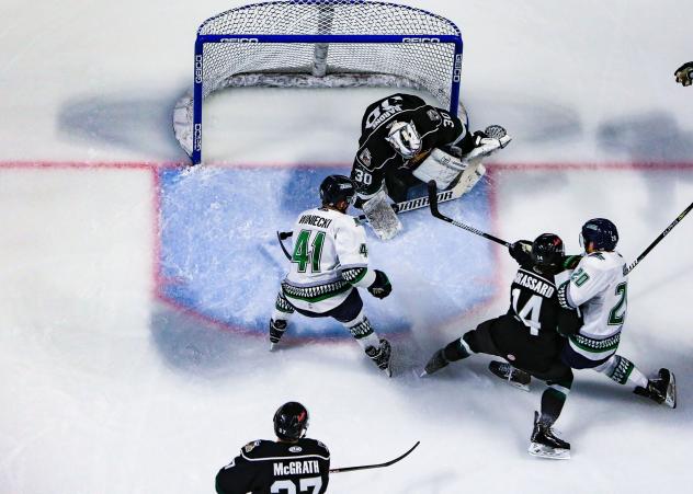 Utah Grizzlies goaltender Brad Barone tries to fend off the Florida Everblades