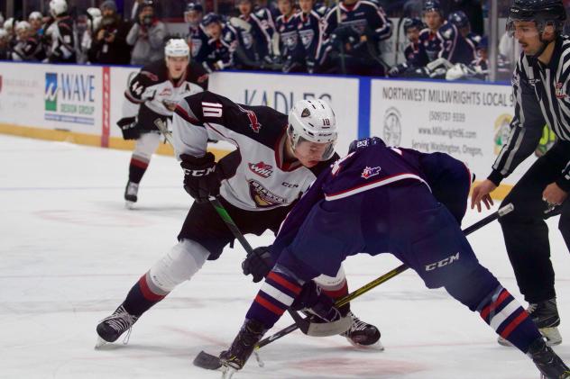 Vancouver Giants left wing Zack Ostapchuk (left) vs. the Tri-City Americans