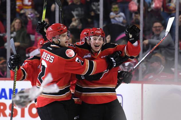 Carson Focht of the Calgary Hitmen celebrates his Teddy Bear Goal