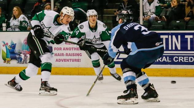 Texas Stars left wing Riley Tufte (left) vs. the Milwaukee Admirals