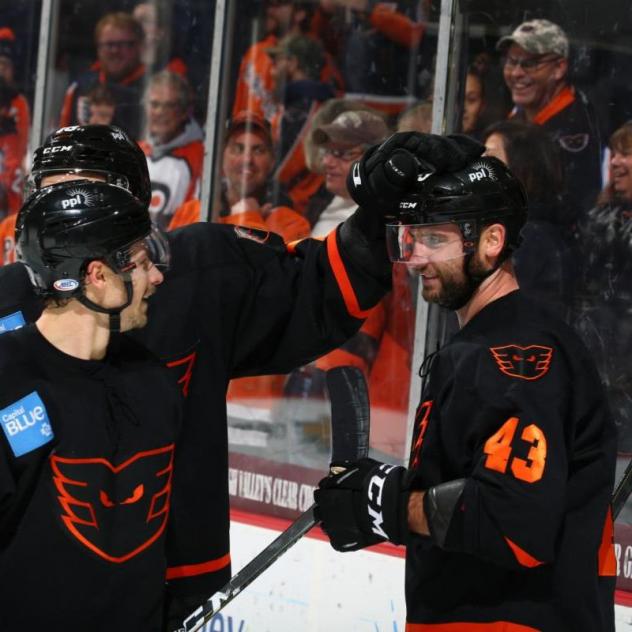 T.J. Brennan receives congratulations from his Lehigh Valley Phantoms teammates