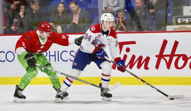 Vancouver Giants left wing Zach Ostapchuk (left) vs. the Spokane Chiefs