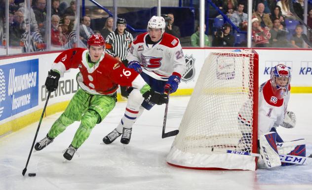 Vancouver Giants centre Cole Shepard handles the puck in back of the Spokane Chiefs goal