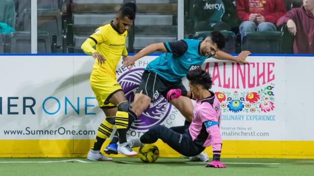 St. Louis Ambush goalkeeper Paulo battles Ian Bennett of the Milwaukee Wave (left)