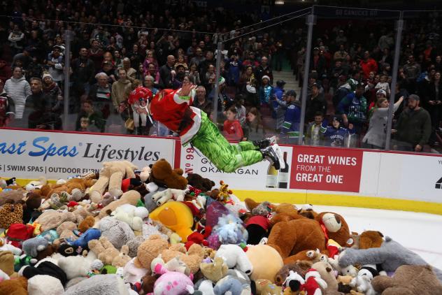 Vancouver Giants in Teddy Bear Toss jersey dive into a bile of bears