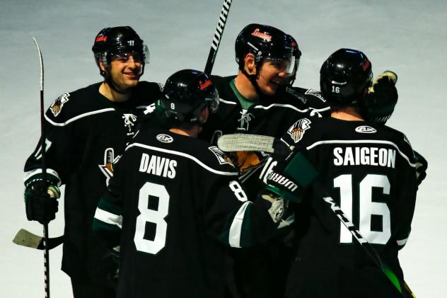Utah Grizzlies huddle up to celebrate a goal