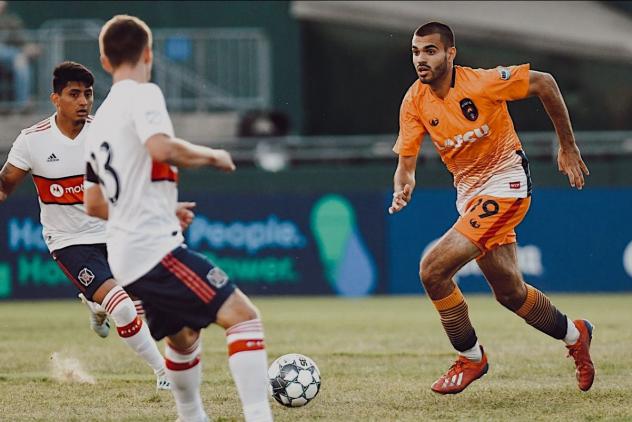 Forward Pato Botello-Faz (right) with Lansing Ignite