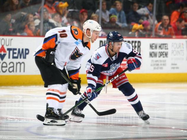 Lehigh Valley Phantoms left wing Greg Carey (left) against the Hartford Wolf Pack