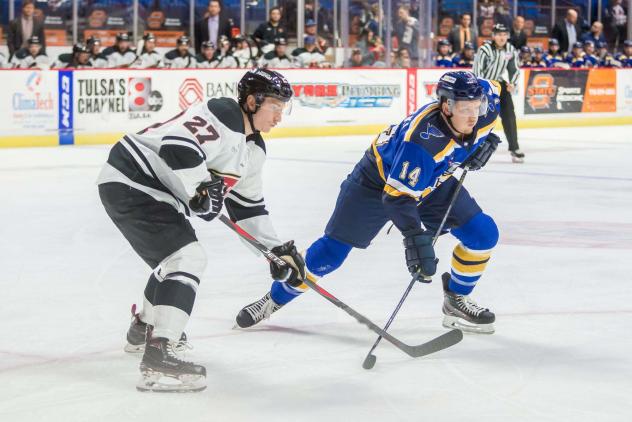 Austin Poganski with the Tulsa Oilers (right)