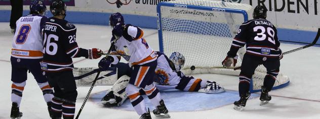 Dan DeSalvo of the South Carolina Stingrays (right) scores against the Orlando Solar Bears