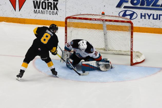 Kelowna Rockets goaltender Roman Basran stops Ty Thorpe of the Brandon Wheat Kings in the shootout