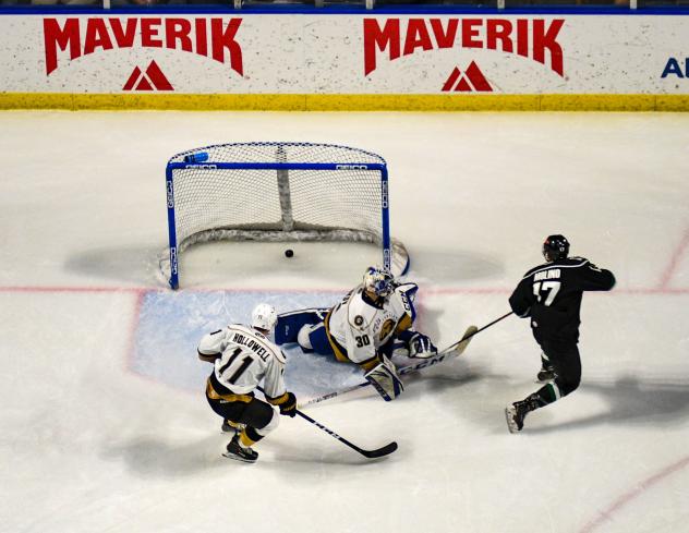 Griffen Molino of the Utah Grizzlies (right) scores against the Newfoundland Growlers
