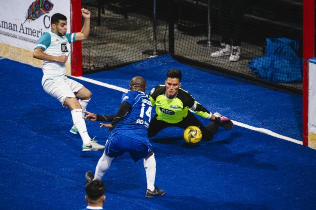 Kansas City Comets forward Leo Gibson eyes a loose ball in front of the St. Louis Ambush goal