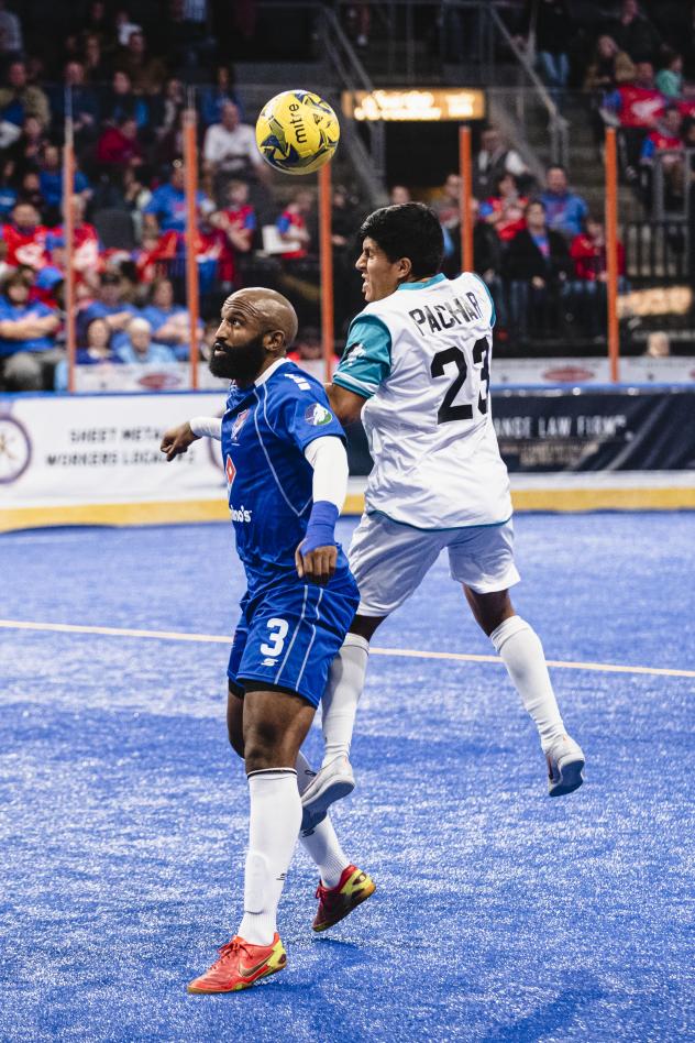 Kansas City Comets defender Ray Lee (left) battles the St. Louis Ambush