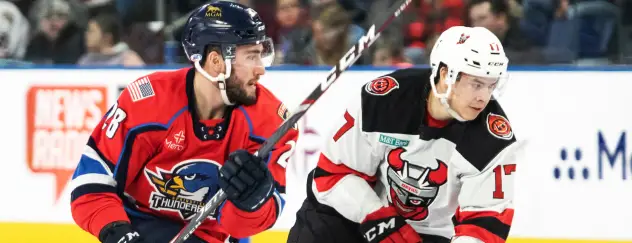 Binghamton Devils center Egor Sharangovich (right) vs. the Springfield Thunderbirds