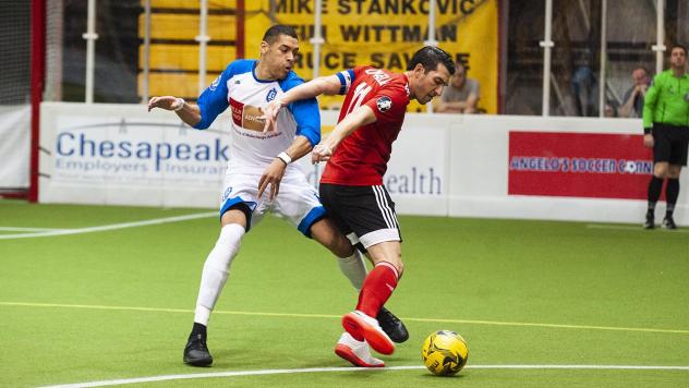 Former Blast player Onua Obasi (left) with Utica City FC, defending Baltimore Blast captain Tony Donatelli