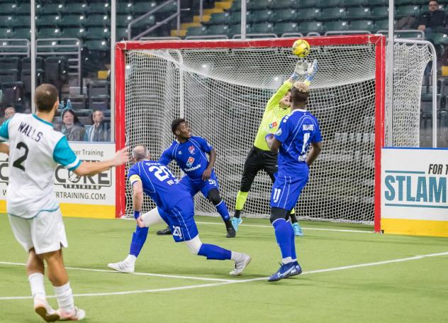 St. Louis Ambush forward Tony Walls watches his shot head toward the Kansas City Comets goal