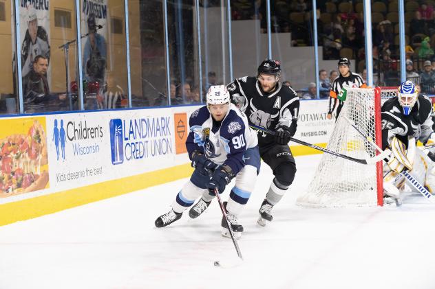 Nathan Walker of the San Antonio Rampage pressures Milwaukee Admirals forward Anthony Richard