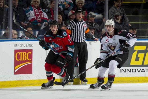 Kelowna Rockets centre Ethan Ernst (left) vs. the Vancouver Giants