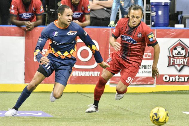 Tacoma Stars' Jamael Cox and Ontario Fury's Joseph Cairel race for a loose ball in the Fury's 10-7 win