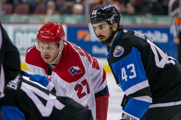 Alex Guptill of the Allen Americans (left) vs. the Wichita Thunder