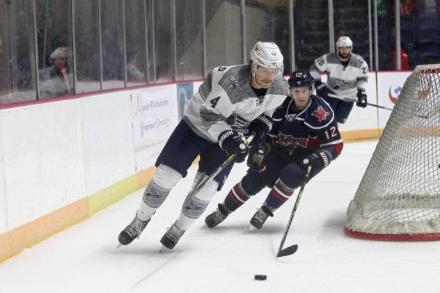 Pensacola Ice Flyers defenseman Tyler Andrews (left) vs. Macon Mayhem right wing Stepan Timofeyev