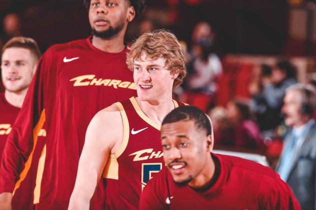 Canton Charge guard J.P. Macura (center) vs. the Long Island Nets