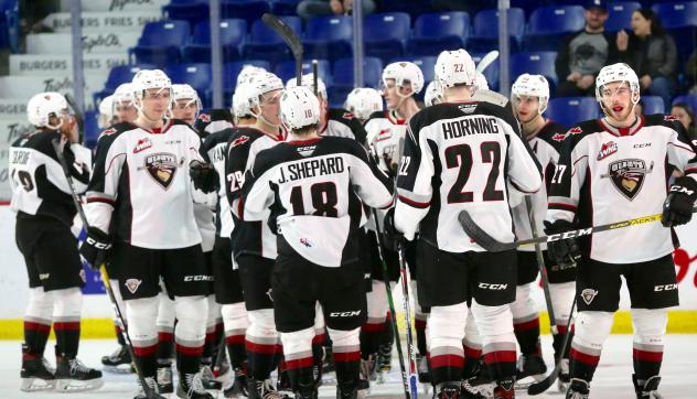 Vancouver Giants exchange congratulations following a win over the Kelowna Rockets