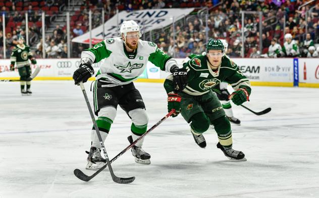 Texas Stars defenseman Joseph Cecconi (left) vs. the Iowa Wild