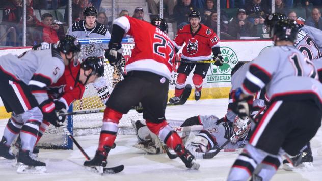 Adirondack Thunder defenseman Kelly Summers (center) vs. the Brampton Beast