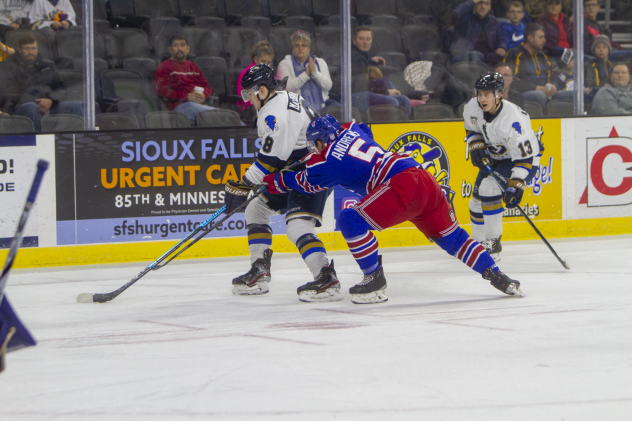 Sioux Falls Stampede forward Cameron MacDonald (left) vs. the Des Moines Buccaneers