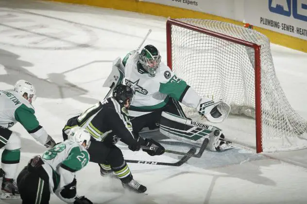 Texas Stars goaltender Landon Bow reaches for a puck against the Chicago Wolves