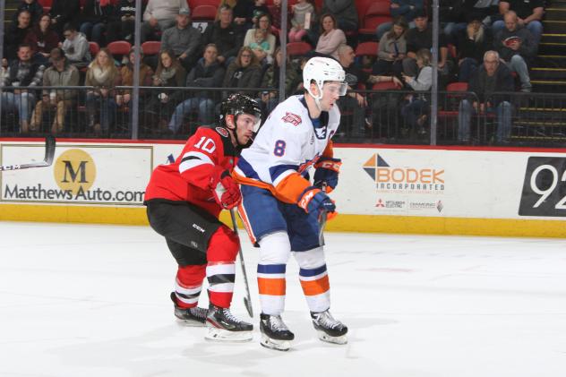 Binghamton Devils center Ben Street (left) vs. the  Bridgeport Sound Tigers