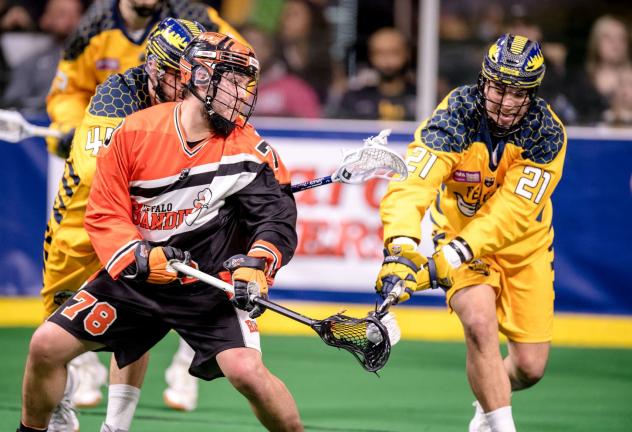 Brendan Bomberry of the Georgia Swarm (right) defends against the Buffalo Bandits