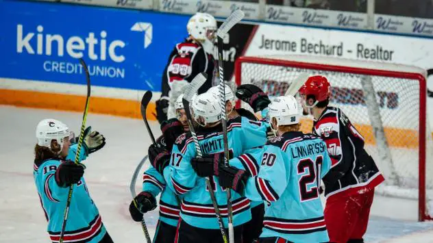 Columbus River Dragons celebrate against the Port Huron Prowlers