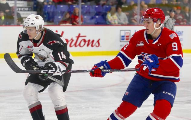 Vancouver Giants centre Eric Florchuk (left) vs. the Spokane Chiefs