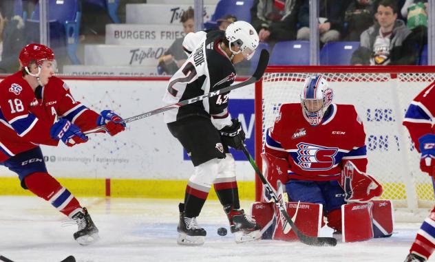 Vancouver Giants centre Justin Sourdif challenges the Spokane Chiefs