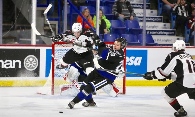 Vancouver Giants centre Tristen Nielsen delivers a blow against the Victoria Royals