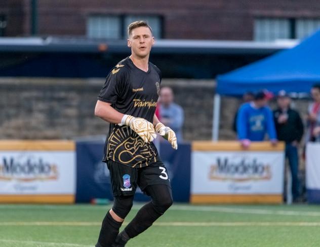 Forward Madison FC goalkeeper Brandon Barnes