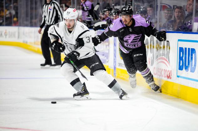 Jake Walman of the San Antonio Rampage controls the puck against the Colorado Eagles